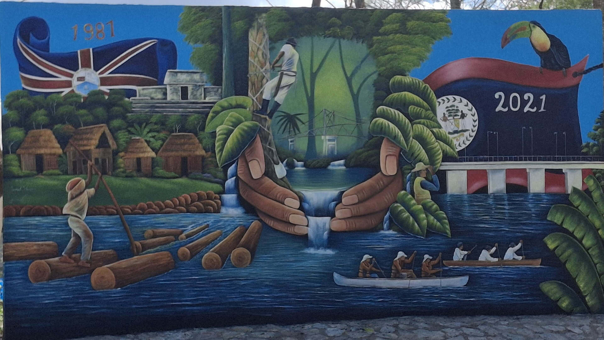 Traditional Belizean river scene mural with local people and wildlife.